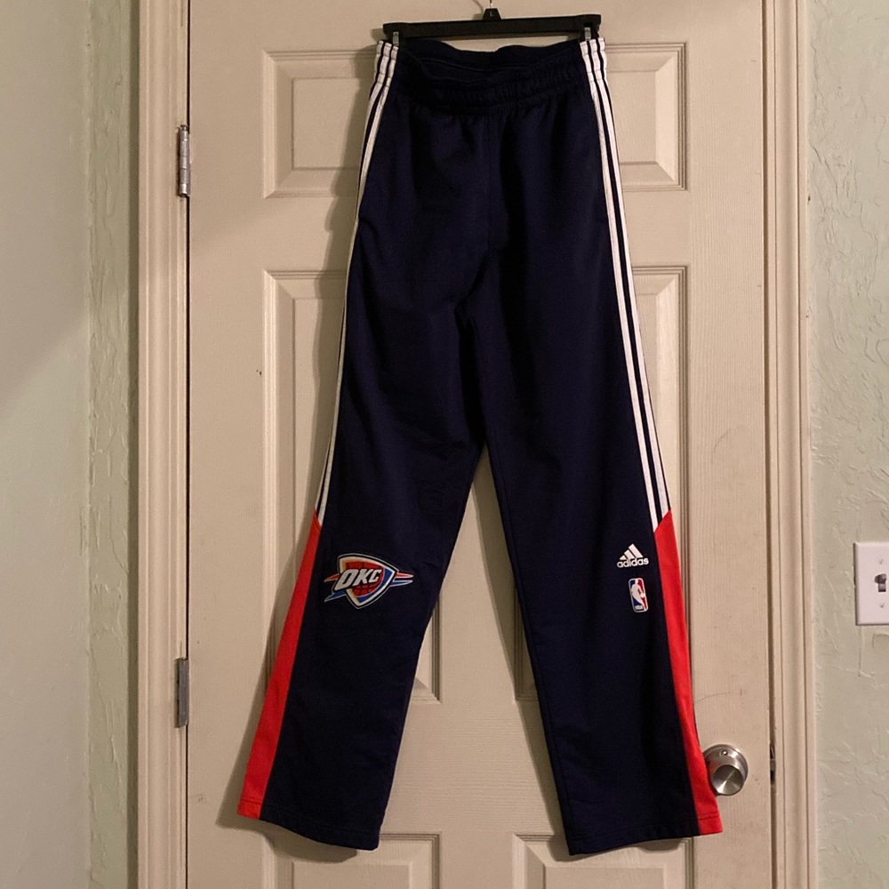 Thunder player warm up pants. Size small but long.